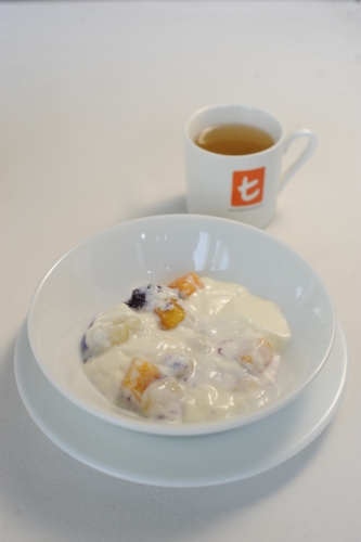 Yoghurt and fruit , lightly sweetned