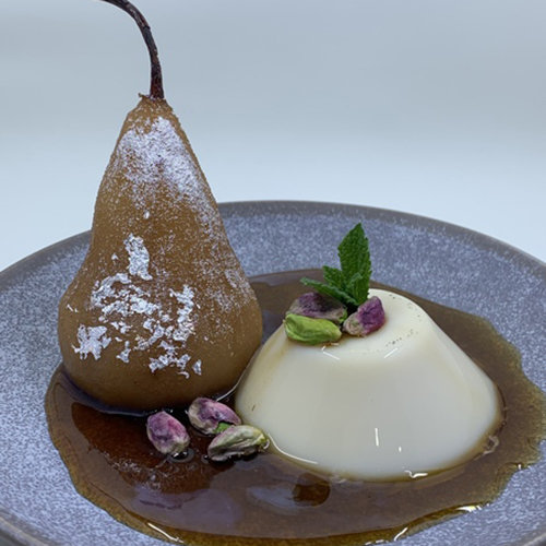 Poached Ceylon Spice chai pear with honey milk pudding.