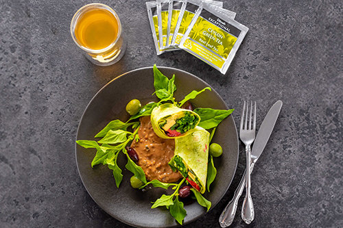 Spinach Wraps with Basil, Cashew Cheese, Olives & Marinated Vegetables with Natural Green Tea and Sweet Chili Nam Jam