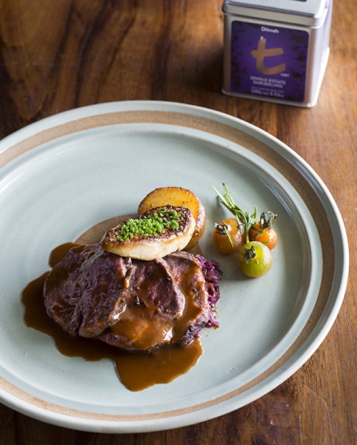 Slow Roasted Tenderloin With Pan-Seared Foie Gras, Braised Cabbage And Fondant Potatoes In Red Wine Jus